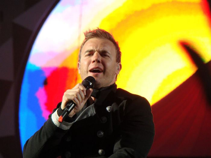 Gary Barlow, patron of Child Bereavement UK, singing live in concert with Take That