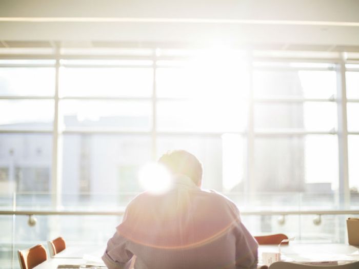 Employee sitting at meeting table