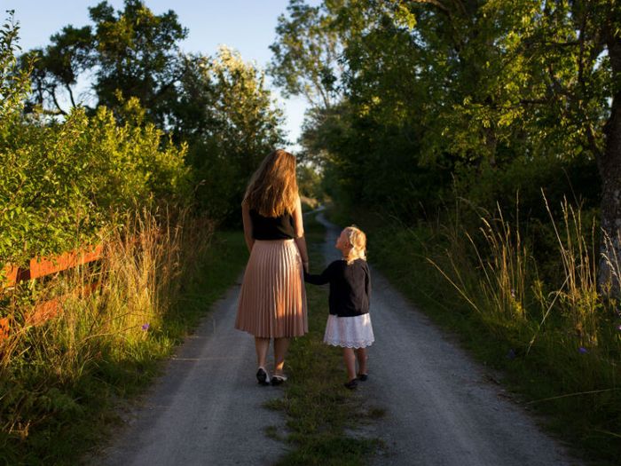 Woman and child walking to funeral