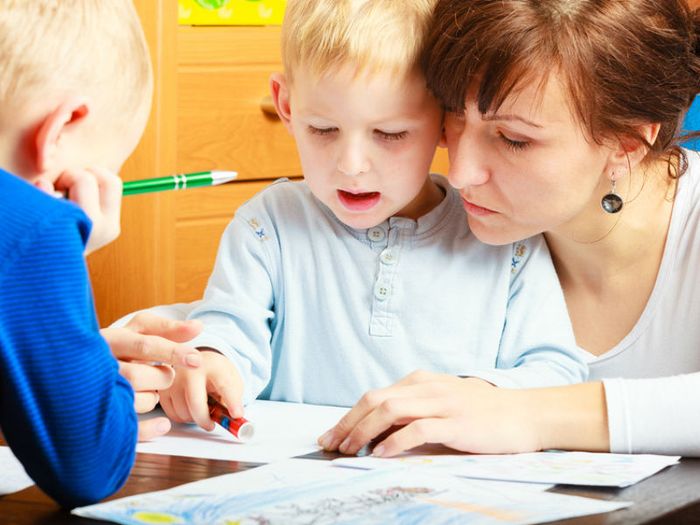 Carer playing with child at a children's hospice