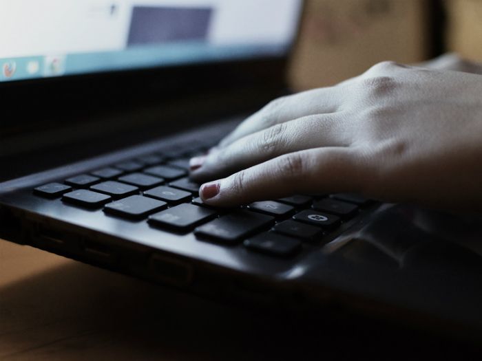 Woman posting about a bereavement online