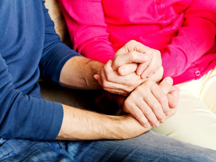 Holding hands while talking about death and dying