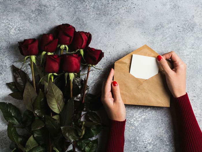 A condolence card and sympathy flowers
