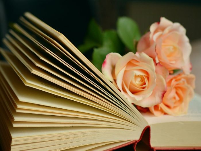 Roses on top of a book of funeral poems